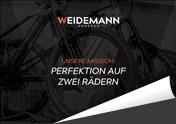 Eine Grafik mit der Aufschrift: Weidemann - Interaktive Broschüre - Perfektion auf zwei Rädern